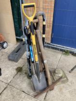 A quantity of garden tools & concrete urn base