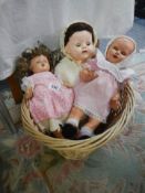 Three vintage dolls.