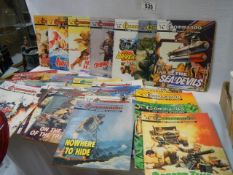 A quantity of Commando comics.