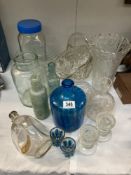 A quantity of heavy glass items in clear & blue glass