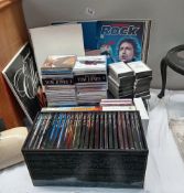 A quantity of CDs, LPs & The history of rock cassettes