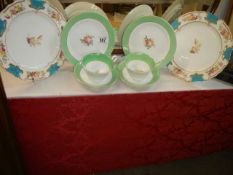 Two hand painted trio's and two hand painted plates.