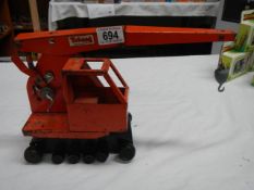 A Triang toy tin plate crane.
