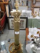 A brass Corinthian column table lamp base.