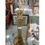 A brass Corinthian column table lamp base.