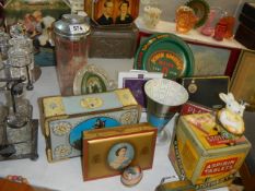 A mixed lot of vintage tins etc.,