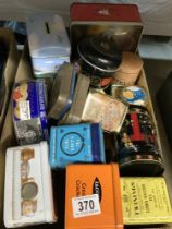 A box of vintage tins including tea Caddys