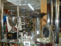 A mixed lot of silver plate including candlestick, vase, trophy etc.,