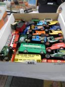 A mixed lot of die cast buses and vans.