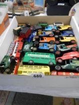 A mixed lot of die cast buses and vans.