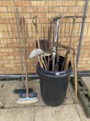 A quantity of garden tools & 3 brooms
