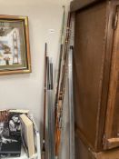 A collection of various fishing rods