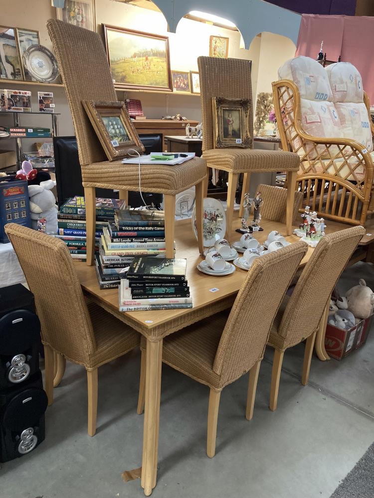 A dining table with 6 Rattan effect chairs COLLECT ONLY