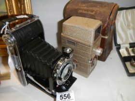 A G B Bell Howell vintage camera and an Agfa folding camera.