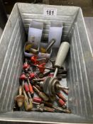 A quantity of router bits, some new.