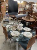 Extending glass top dining table with chairs