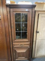 Tall dark wood unit Glass fronted top