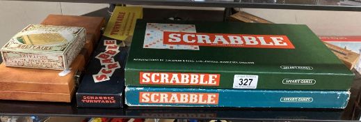 2 Scrabble games, 1 unopened inside, A Scrabble turntable, Compendium & Solitaire