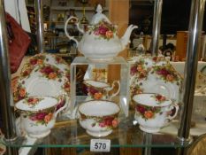 Nine pieces of Royal Albert Old Country Roses teaware including teapot.