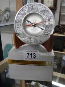 A boxed Oriental pewter clock.