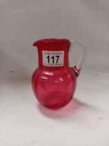 A cranberry jug