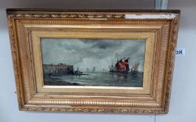 A gilt framed oil on canvas of sailing boats near the shore. Frame 63 x 36cm, Image 17 x 34.5cm