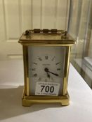 A brass carriage clock marked Bayard.