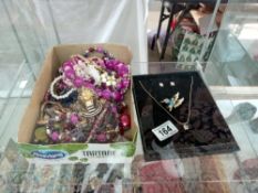 A quantity of beads & costume jewellery