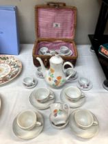 A child's tea set etc in Wicker basket.