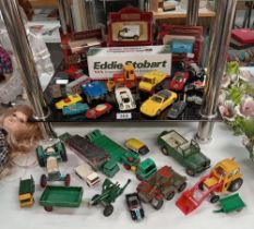 A quantity of boxed / unboxed diecast vehicles etc