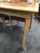 An original Lloyd Loom dining table and 6 chairs. COLLECT ONLY