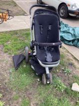A Quinny 3 wheeler pushchair