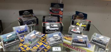 A quantity of boxed diecast cars by Cararama, matchbox etc