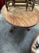 A mahogany oval dining table with carved single pedestal on castors. COLLECT ONLY