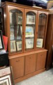 A teak effect part glazed dresser, Etched glass, interior lighting and mirror. COLLECT ONLY