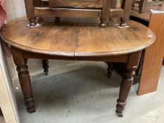 A late 19th early 20thc Mahogany dining table over turned and reeded legs COLLECT ONLY