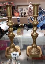 A pair of Victorian brass candlesticks