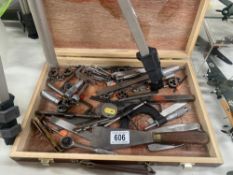 A box of engineering tools including taps, dies, micrometer etc