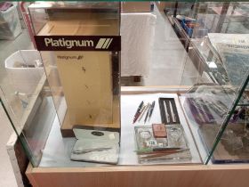 An advertising platignum pen display cabinet inc well & assortment of pens