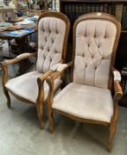 A pair of upholstered button back arm chairs. COLLECT ONLY.