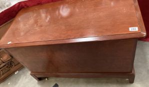 A mahogany effect blanket box on bracket legs. COLLECT ONLY