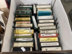 A box of 8 track cassettes