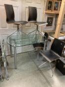 A Scandinavian style glass extending table with 4 bentwood and vinyl chairs. COLLECT ONLY