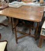 An Oak rectangular drop leaf table water mark to top. COLLECT ONLY