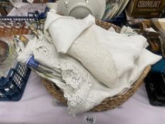 A basket of teatowels & tablecloths