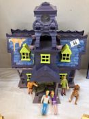 A Scooby Doo haunted house & character figures