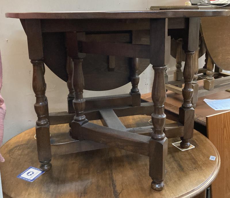 An oak drop leaf table with turned legs and solid supports. COLLECT ONLY - Image 2 of 3