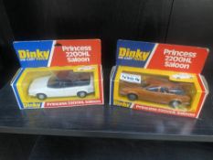 Two boxed Dinky No.123 Princess 2200HL saloon cars in white and copper.