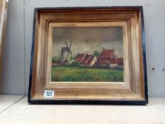 An oil on canvas of cottages & a windmill