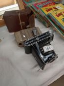 A G B Bell Howell vintage camera and an Agfa folding camera.